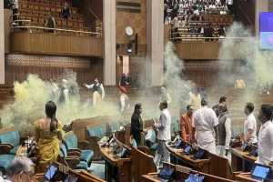 security-breach-two-men-jump-into-lok-sabha-from-gallery-mps-say-they-sprayed-a-gas-no-security