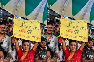 RCB-True-Fan-Goes-Viral-Womans-Dramatic-Banner-Steals-the-Spotlight-During-IPL-2025-Playoffs