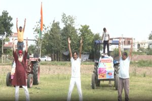 On-International-Yoga-Day-farmers-performed-yoga-with-tractors-at-the-border